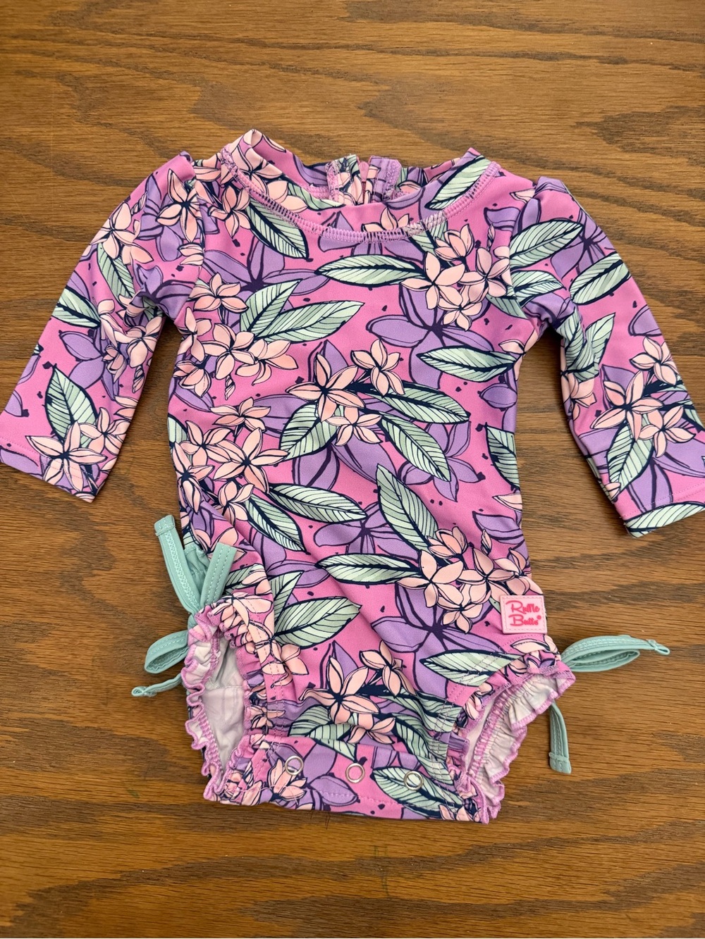 RuffleButts Floral Long Sleeve Rash Guard Swimsuit 0-3M